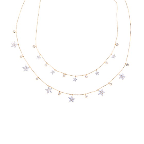 A two-layer gold-plated necklace with ornate shapes and studded with zirconium