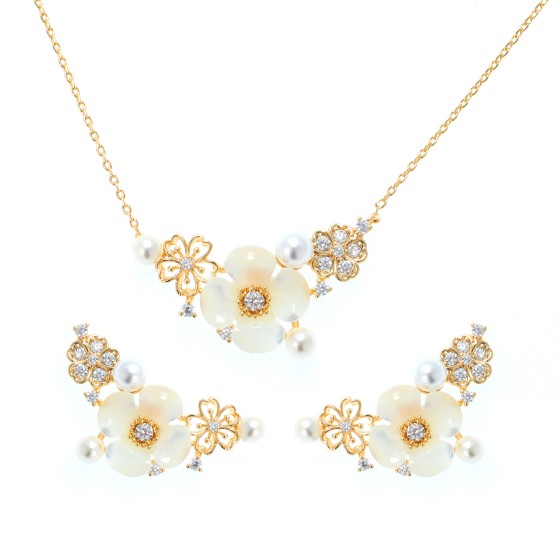 Small  set delicate plated with gold ,studded with zircon stones with 